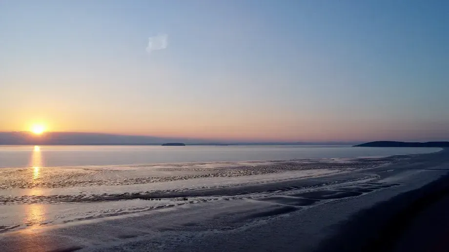 Sunset over Berrow and Brean Sands with Steep Holme island in the distance on the Somerset coast